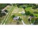 Expansive aerial view highlights the vast land, horse paddock, and the home's secluded location at 12434 Sullivan Rd, Clermont, FL 34715