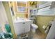 Cozy bathroom featuring bright yellow tile and a white sink at 12434 Sullivan Rd, Clermont, FL 34715
