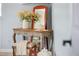 Charming bedroom decor featuring a vanity with a mirror, stool, and lantern at 12434 Sullivan Rd, Clermont, FL 34715