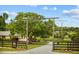 Charming property entrance with 'Morning Star Stables' gate and mature trees at 12434 Sullivan Rd, Clermont, FL 34715