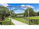 Picturesque entry gate to 'Morning Star Stables' with wooden archway at 12434 Sullivan Rd, Clermont, FL 34715