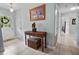 Inviting foyer with tile floors, decorative table, and neutral paint at 12434 Sullivan Rd, Clermont, FL 34715