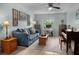 Bright living room featuring tile floors and plenty of natural light at 12434 Sullivan Rd, Clermont, FL 34715