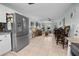 Open-concept space combines kitchen, living, and dining areas for modern living and entertaining at 12434 Sullivan Rd, Clermont, FL 34715