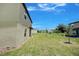 Expansive backyard with green lawn and neighboring homes at 1303 Congo Ct, Kissimmee, FL 34759