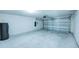 Spacious garage with an aluminum garage door at 1303 Congo Ct, Kissimmee, FL 34759