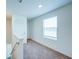 Bright hallway with neutral carpeting, a window, and a door, offering a simple and clean aesthetic at 1303 Congo Ct, Kissimmee, FL 34759
