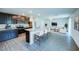 Open concept kitchen with island, stainless appliances, and a view into the living room at 1303 Congo Ct, Kissimmee, FL 34759