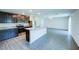 Kitchen with granite countertops, stainless steel appliances, island and open layout to the living space at 1303 Congo Ct, Kissimmee, FL 34759