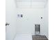 Practical laundry room includes overhead shelving and space for a washer and dryer at 1303 Congo Ct, Kissimmee, FL 34759