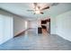 Bright, open-concept living space with wood-look floors and a kitchen featuring a granite island at 1303 Congo Ct, Kissimmee, FL 34759