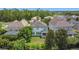 Aerial shot displaying the home's backyard, neighborhood, and surrounding green spaces at 137 Drayton Ave, Davenport, FL 33837