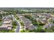 Aerial view of the neighborhood featuring lush landscaping, a lake, and well-maintained streets at 137 Drayton Ave, Davenport, FL 33837