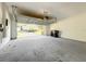 Spacious garage with an open door offering ample parking and storage space at 137 Drayton Ave, Davenport, FL 33837