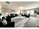 Open-concept living room with a glass coffee table, modern furnishings and a bright, airy atmosphere at 137 Drayton Ave, Davenport, FL 33837
