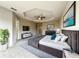 Spacious main bedroom featuring a tray ceiling, ceiling fan, a television, and neutral decor at 137 Drayton Ave, Davenport, FL 33837