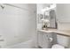 Well-lit bathroom with white tiling, vanity with storage, and shower/tub combo at 1400 Lake Shadow Cir # 10104, Maitland, FL 32751