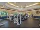 Spacious fitness center with treadmills, weight machines, and ample natural light for a comfortable workout at 1400 Lake Shadow Cir # 10104, Maitland, FL 32751