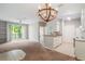 Bright living room featuring balcony access, neutral paint, and modern light fixtures at 1400 Lake Shadow Cir # 10104, Maitland, FL 32751