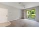 Open living space with tile entry, neutral carpeting, and balcony access at 1400 Lake Shadow Cir # 10104, Maitland, FL 32751