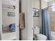 Ensuite bathroom with tile floors, a shower with blue curtain, and view to a bedroom at 14038 Bluebird Park Rd, Windermere, FL 34786
