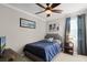 Cozy bedroom features a full bed, side table, decor, and a relaxing ambiance at 14038 Bluebird Park Rd, Windermere, FL 34786