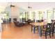 A spacious clubhouse provides a comfortable gathering area with elegant seating and dining options for residents at 14038 Bluebird Park Rd, Windermere, FL 34786