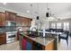 Spacious kitchen featuring a large island with bar seating and stainless steel appliances at 14038 Bluebird Park Rd, Windermere, FL 34786