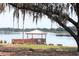 Scenic lake view from the community gazebo, providing a tranquil retreat by the water at 14038 Bluebird Park Rd, Windermere, FL 34786