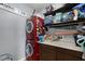 Functional laundry room with stacked washer and dryer, counter space, and shelving at 14038 Bluebird Park Rd, Windermere, FL 34786