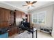 Spacious home office featuring custom built-in shelving, providing ample storage and workspace at 14038 Bluebird Park Rd, Windermere, FL 34786