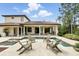 This backyard has an in-ground pool, spa, covered patio, and outdoor seating at 1425 Dunbrooke Loop, Longwood, FL 32779
