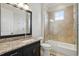 Elegant bathroom boasts a granite vanity top, and tiled shower with glass surround at 1425 Dunbrooke Loop, Longwood, FL 32779