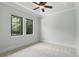 A simple and spacious bedroom is filled with natural light from two windows at 1425 Dunbrooke Loop, Longwood, FL 32779
