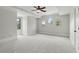 Spacious bedroom with multiple windows and neutral carpeting, perfect for relaxation at 1425 Dunbrooke Loop, Longwood, FL 32779