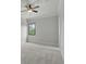 A comfortable bedroom with a view into the back yard at 1425 Dunbrooke Loop, Longwood, FL 32779