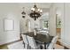 Bright dining area with tray ceilings, and views into the living room and kitchen at 1425 Dunbrooke Loop, Longwood, FL 32779