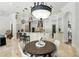 Spacious kitchen with granite counters, stainless appliances, and large island with pendant lighting at 1425 Dunbrooke Loop, Longwood, FL 32779