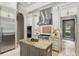 Kitchen with granite counters, island with breakfast bar, and stainless steel appliances at 1425 Dunbrooke Loop, Longwood, FL 32779