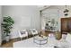 Inviting seating area featuring modern decor and an open floor plan connecting to the dining room at 1425 Dunbrooke Loop, Longwood, FL 32779