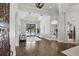 Spacious living room with hardwood floors, tray ceilings, and sliding glass doors to the backyard pool at 1425 Dunbrooke Loop, Longwood, FL 32779