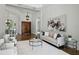 Open-concept living room with hardwood floors, stylish furnishings, and plenty of natural light at 1425 Dunbrooke Loop, Longwood, FL 32779