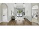 Spacious living room with a sliding glass door leading to the backyard and pool area at 1425 Dunbrooke Loop, Longwood, FL 32779