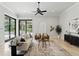 Bright living room with tile flooring, neutral furniture, modern decor, and backyard views at 1425 Dunbrooke Loop, Longwood, FL 32779