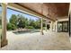 A stunning covered patio features a pool, fan, and multiple seating areas at 1425 Dunbrooke Loop, Longwood, FL 32779