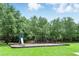 The community playground has swings and a slide for Gathering fun at 1425 Dunbrooke Loop, Longwood, FL 32779