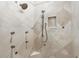 Walk-in shower featuring designer tilework, multiple showerheads and a built-in niche at 1425 Dunbrooke Loop, Longwood, FL 32779