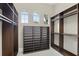 Large walk-in closet with custom shelving and natural light from three arched windows at 1425 Dunbrooke Loop, Longwood, FL 32779