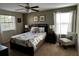 Relaxing bedroom with a queen-sized bed, soft lighting, and coordinated decor at 1439 Moon Valley Dr, Davenport, FL 33896