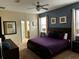 Inviting bedroom with a plush bed, stylish decor, and soft natural light at 1439 Moon Valley Dr, Davenport, FL 33896